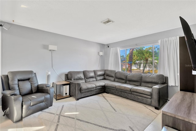 living room with a textured ceiling