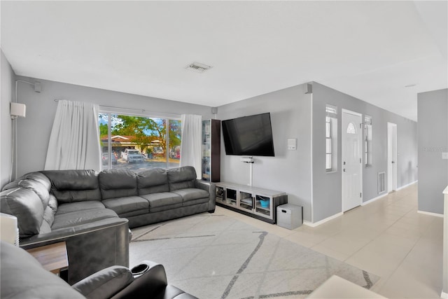 living room with light tile patterned floors