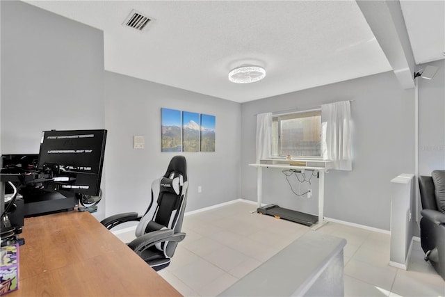 tiled home office featuring a textured ceiling