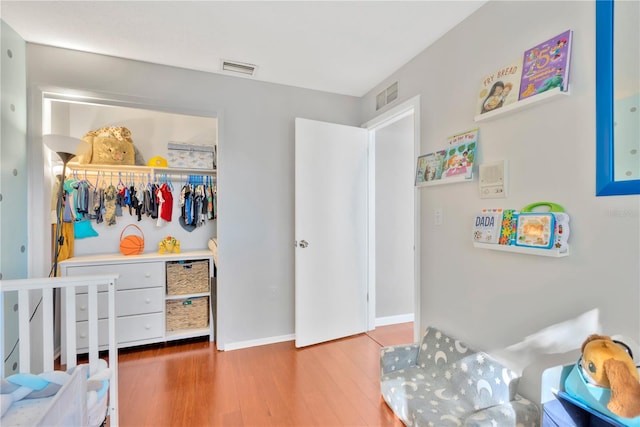 bedroom with hardwood / wood-style floors