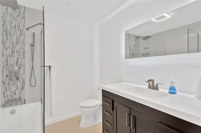 full bathroom with vanity, tiled shower / bath combo, and toilet