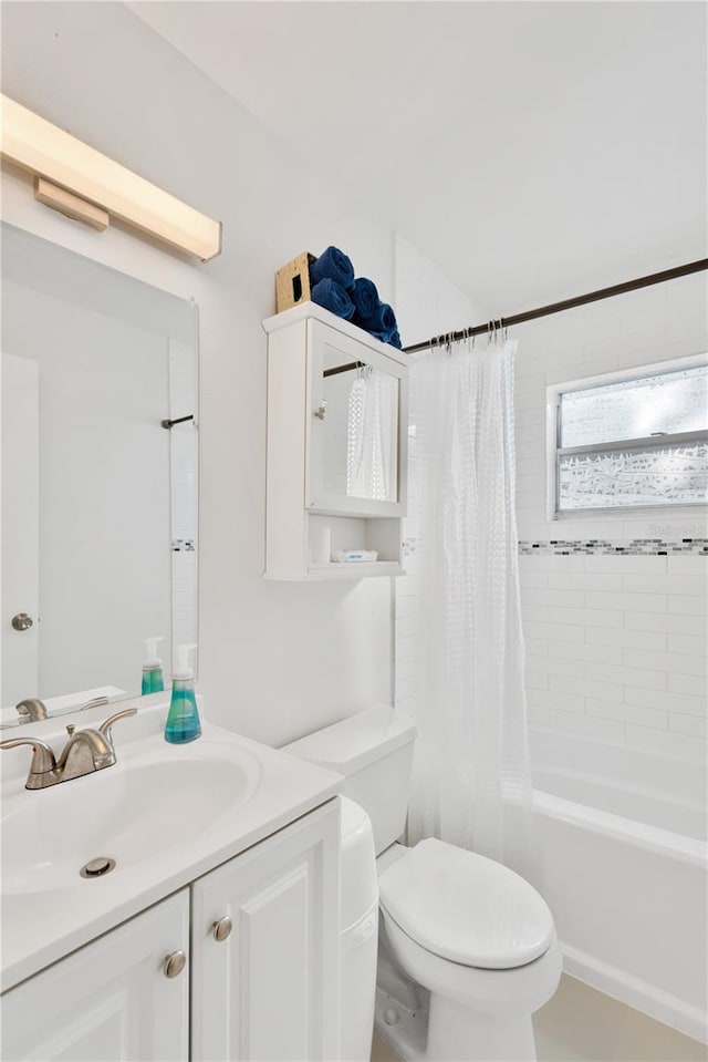 full bathroom with tile patterned floors, vanity, shower / bath combination with curtain, and toilet