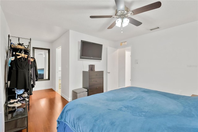 bedroom featuring ceiling fan and hardwood / wood-style floors