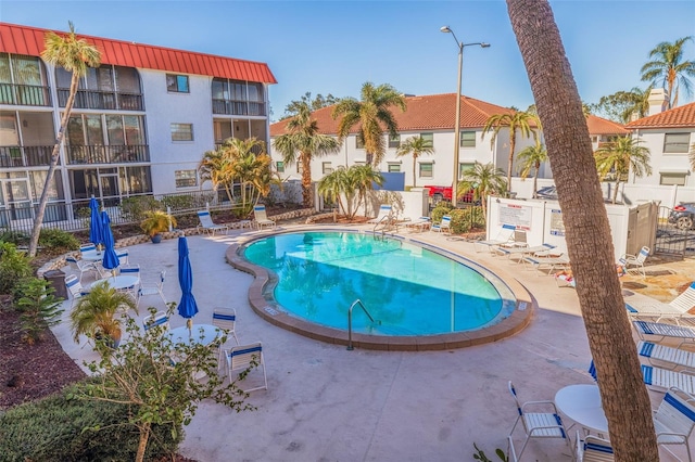 view of swimming pool with a patio area