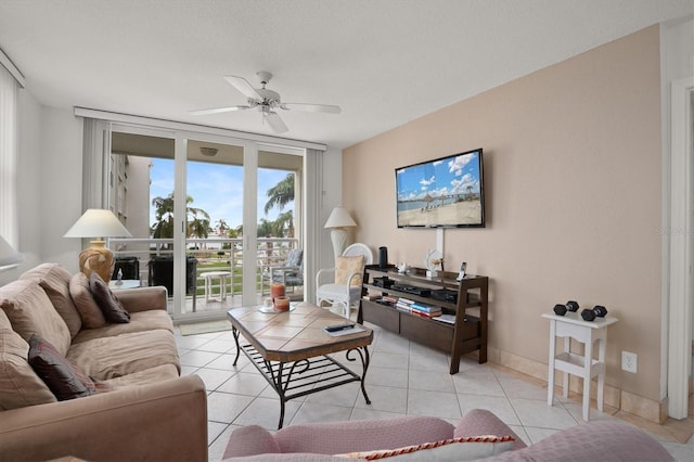 tiled living room with ceiling fan and a textured ceiling