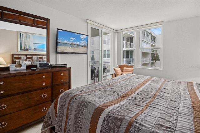 bedroom with multiple windows and a textured ceiling