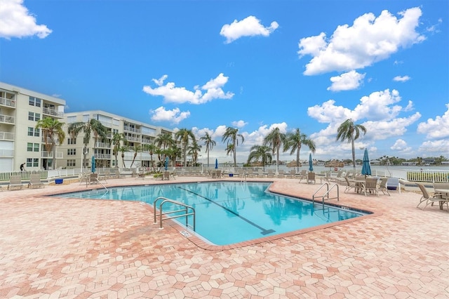 view of swimming pool featuring a patio