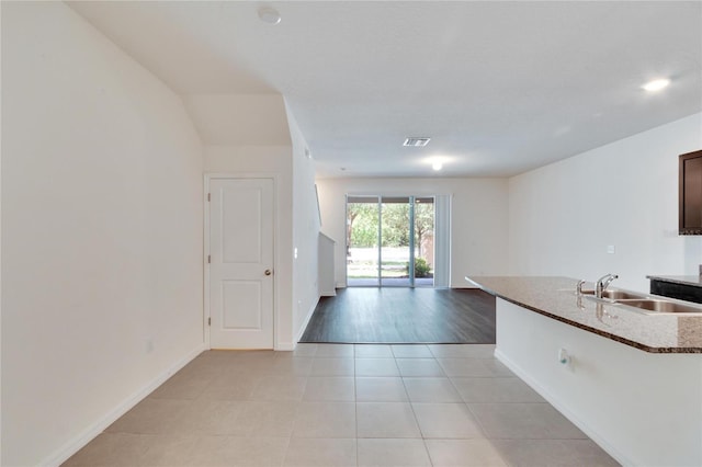 kitchen featuring sink and light hardwood / wood-style flooring