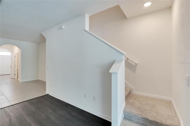 stairs with hardwood / wood-style flooring