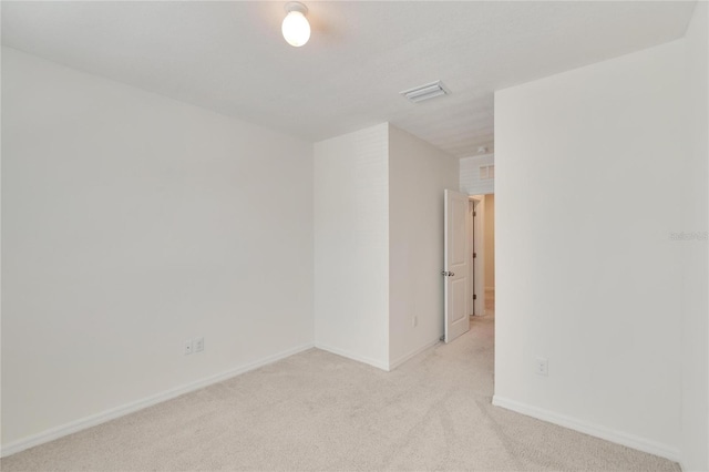 empty room with light colored carpet