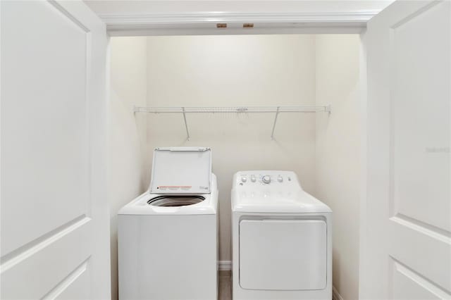 laundry room with independent washer and dryer