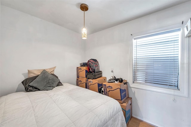 bedroom with wood-type flooring