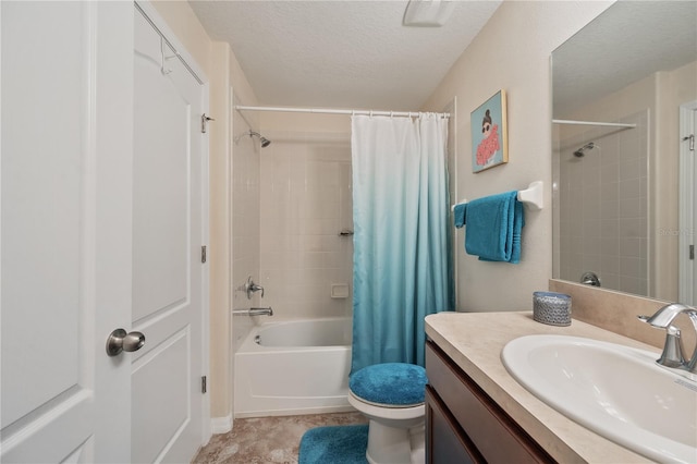 full bathroom with vanity, a textured ceiling, toilet, and shower / bath combo with shower curtain