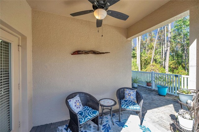 view of patio featuring ceiling fan