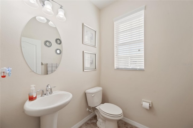 bathroom featuring tile patterned floors, sink, and toilet