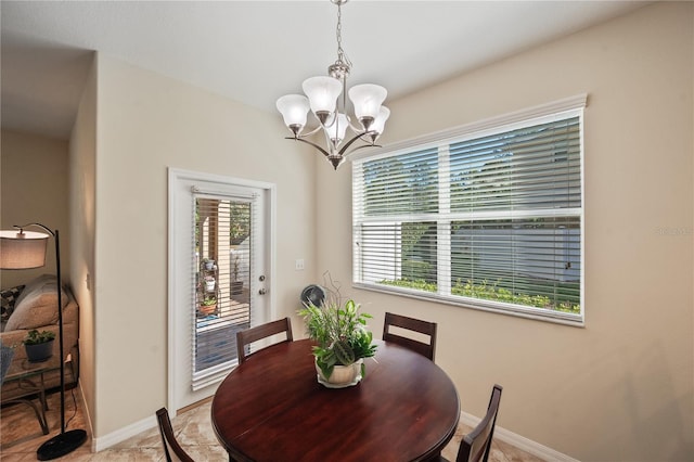 dining room featuring a notable chandelier