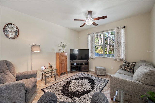 living room featuring ceiling fan and light tile patterned floors