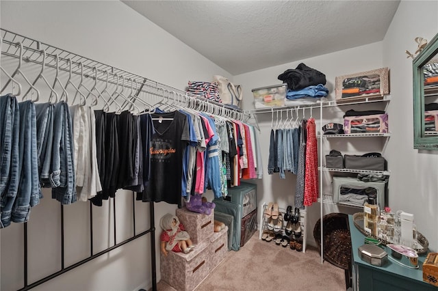 walk in closet featuring carpet