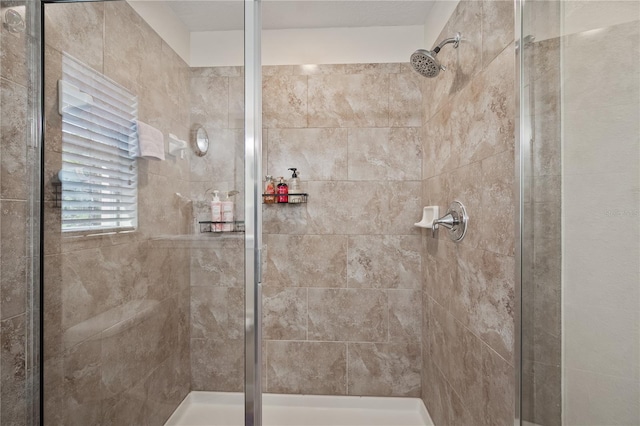 bathroom featuring an enclosed shower