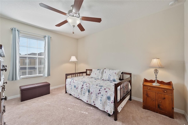 bedroom with light carpet and ceiling fan