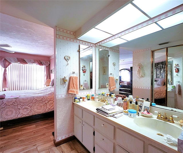 bathroom with wood-type flooring and vanity
