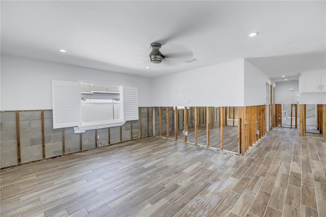 spare room featuring ceiling fan and light hardwood / wood-style floors