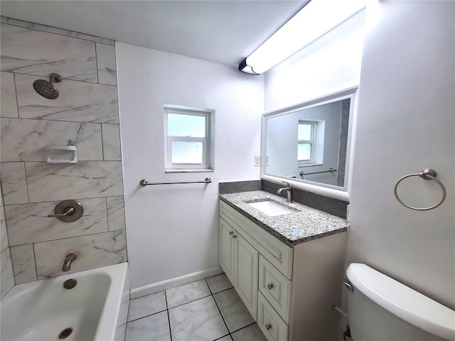 full bathroom with tile patterned floors, vanity, toilet, and tiled shower / bath combo