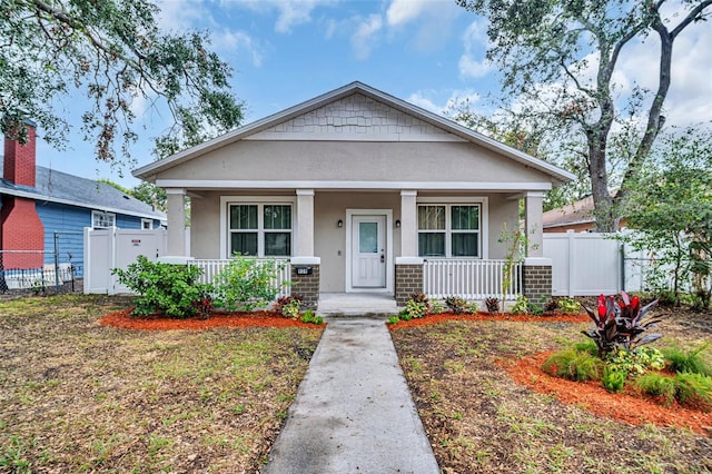 bungalow-style house featuring covered porch