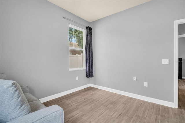 living area with hardwood / wood-style floors