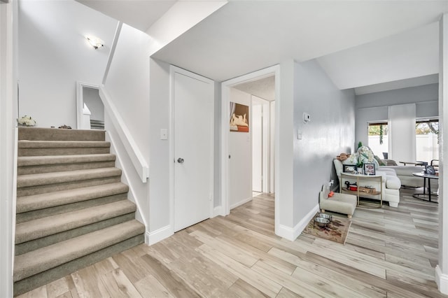 interior space featuring baseboards and wood finished floors