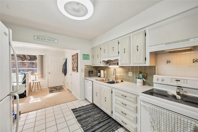 kitchen featuring white appliances, ventilation hood, sink, light tile patterned floors, and white cabinets