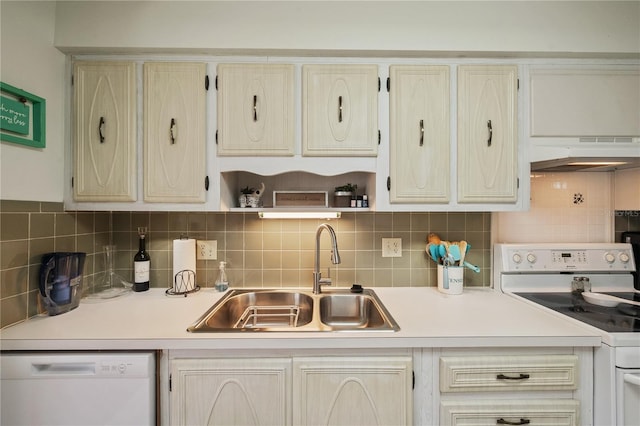 kitchen featuring sink, cream cabinets, white appliances, decorative backsplash, and custom exhaust hood