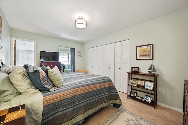 carpeted bedroom with a closet