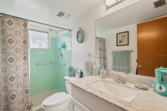 bathroom featuring vanity, curtained shower, and toilet