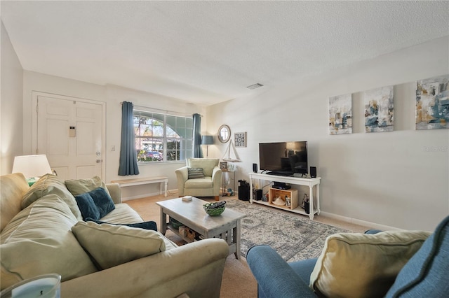 carpeted living room featuring a textured ceiling