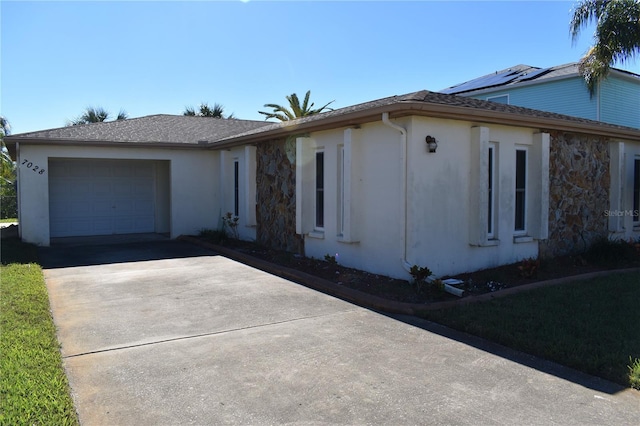 ranch-style house featuring a garage