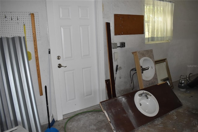 bathroom with toilet and concrete floors