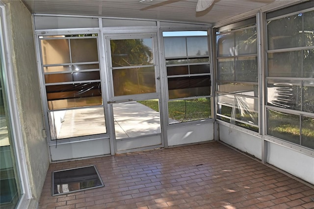 unfurnished sunroom with lofted ceiling