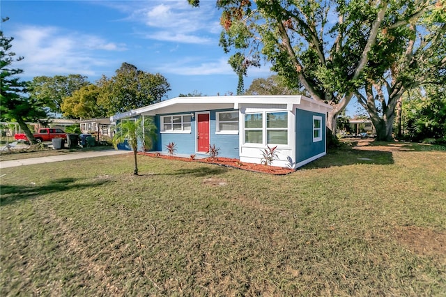 view of outbuilding with a lawn