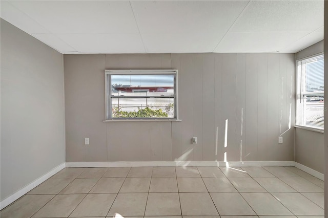 tiled empty room with wooden walls