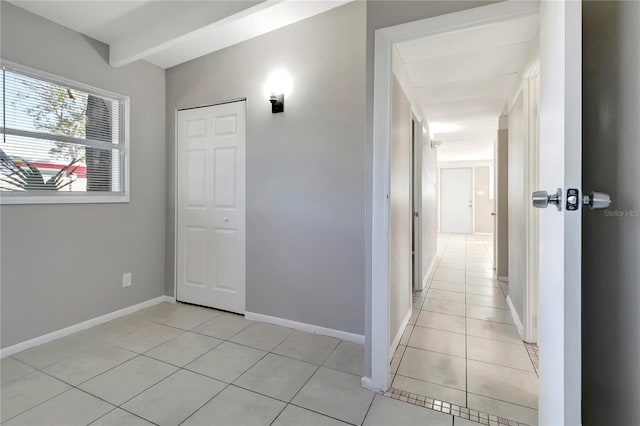 corridor featuring light tile patterned floors