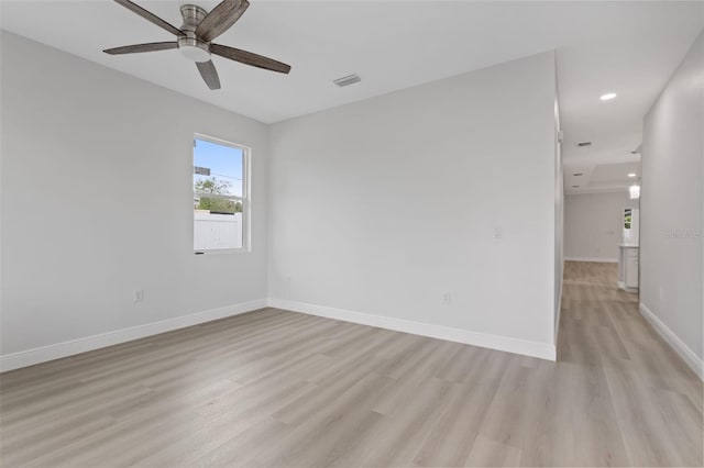 spare room featuring ceiling fan and light wood-type flooring