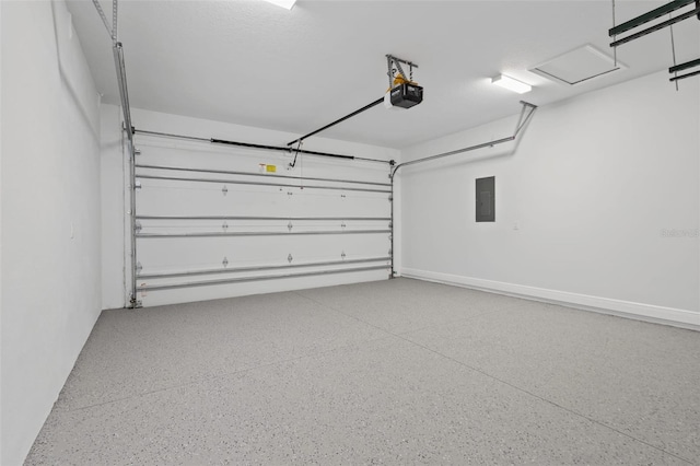 garage with a garage door opener and electric panel