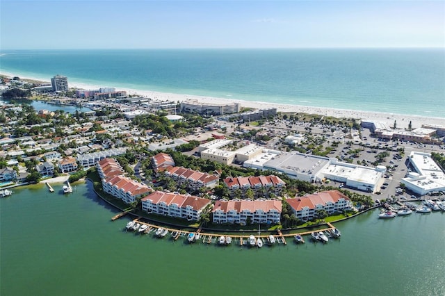 drone / aerial view with a beach view and a water view