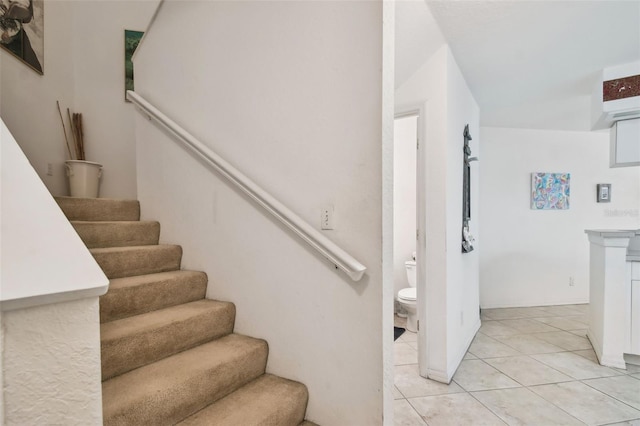 stairs featuring tile patterned floors