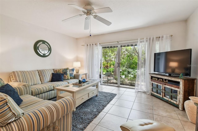 tiled living room featuring french doors and ceiling fan