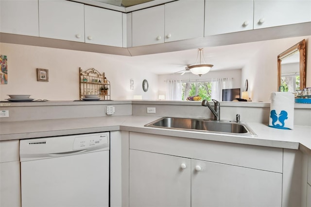 kitchen with white cabinets, dishwasher, and sink