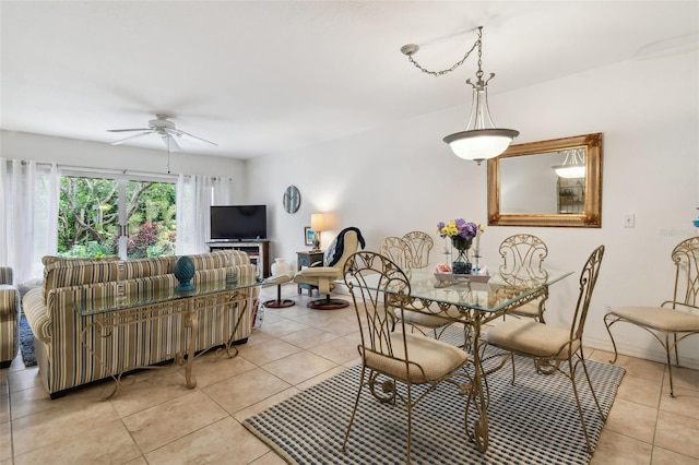 dining area featuring ceiling fan and light tile patterned floors