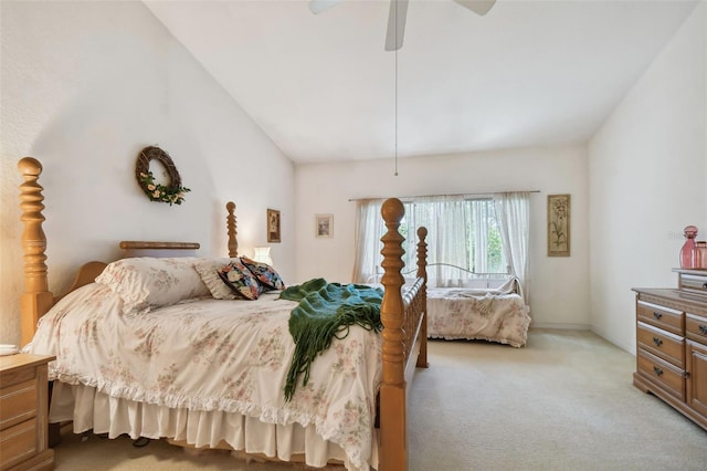 bedroom with ceiling fan, light colored carpet, and vaulted ceiling