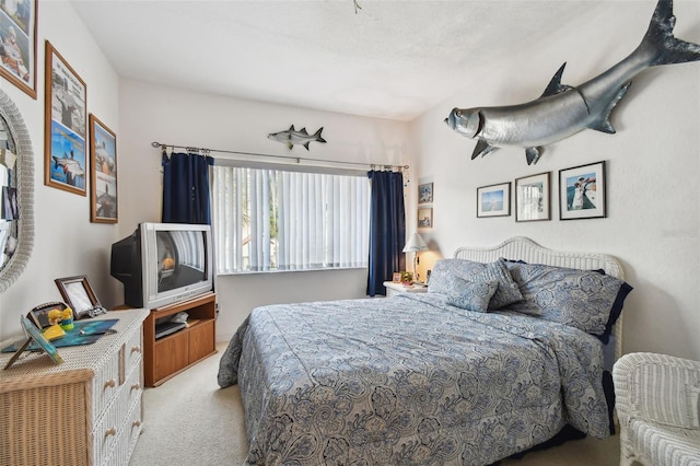 bedroom featuring light colored carpet